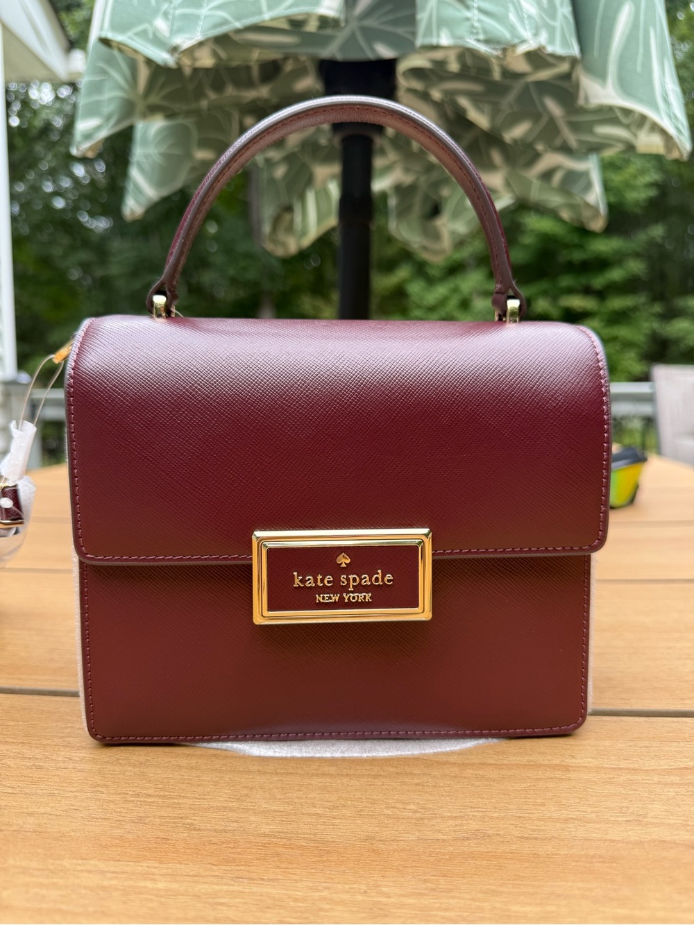 kate spade Burgundy Structured Leather Top-Handle Bag with Gold Plaque